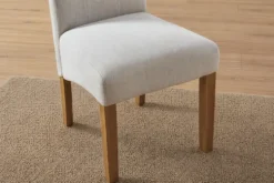 Design Stuhl CASA beige Leinen Massivholzbeine mit Zierknöpfen und Nackenrolle