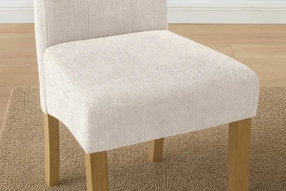 Design Stuhl CASA beige Strukturstoff Massivholzbeine mit Zierknöpfen und Nackenrolle