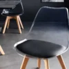 Design Stuhl SCANDINAVIA MEISTERSTÜCK transparent schwarz Kunststoff Buchenholz natur