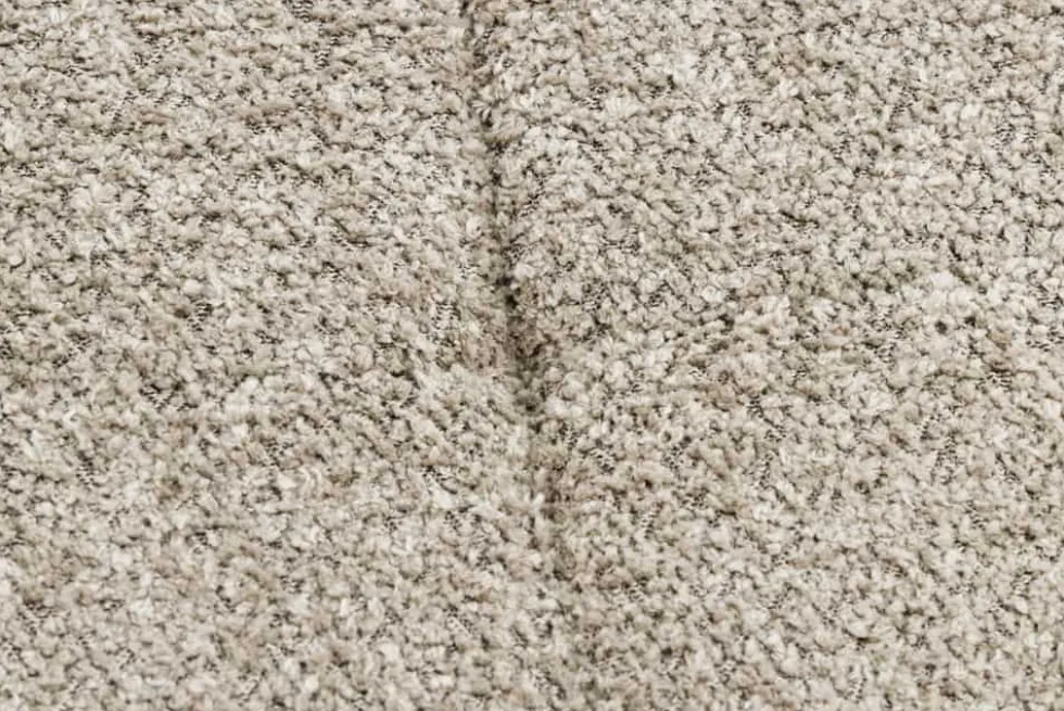 Moderner Hocker SCANDINAVIA champagner greige Bouclé schwarze Metallbeine Fußhocker